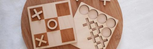 Laser wood cutting used to craft a full wooden tic-tac-toe game