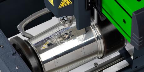 Beer mug being engraved with M40